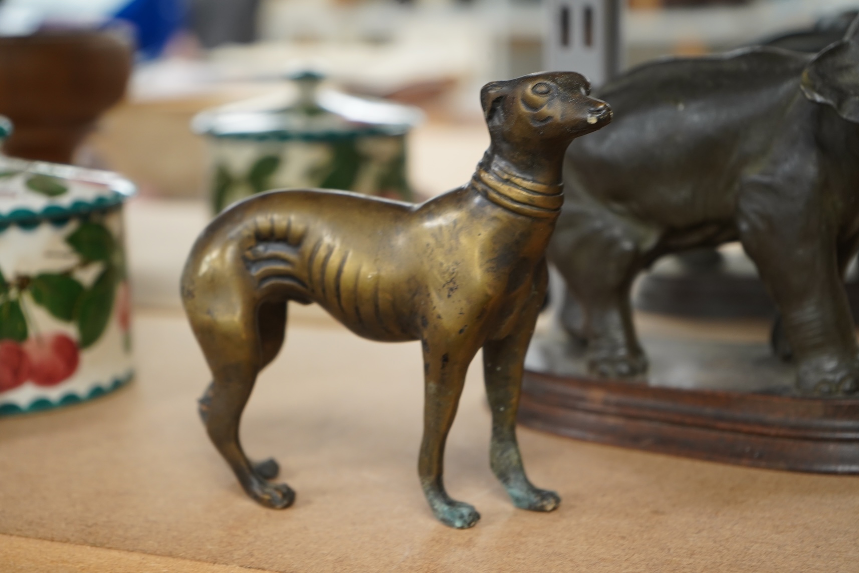 A bronzed metal model of an elephant and a bronze model of a greyhound, tallest 20cm